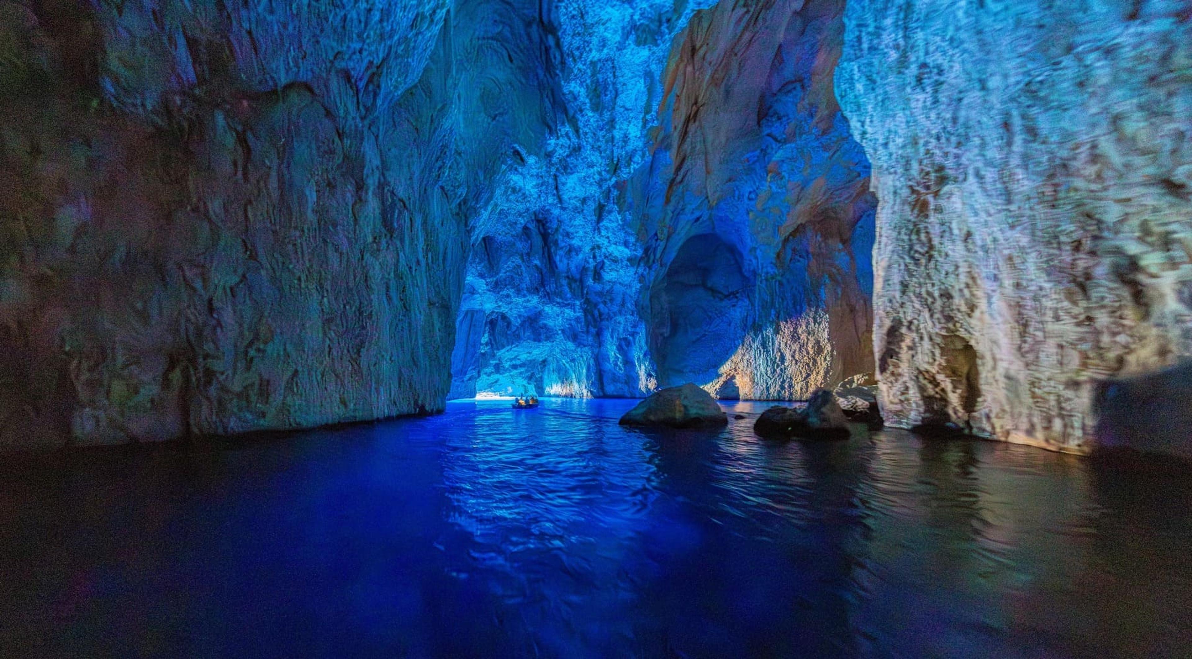 Inside the Blue Cave near Meis, glowing deep blue